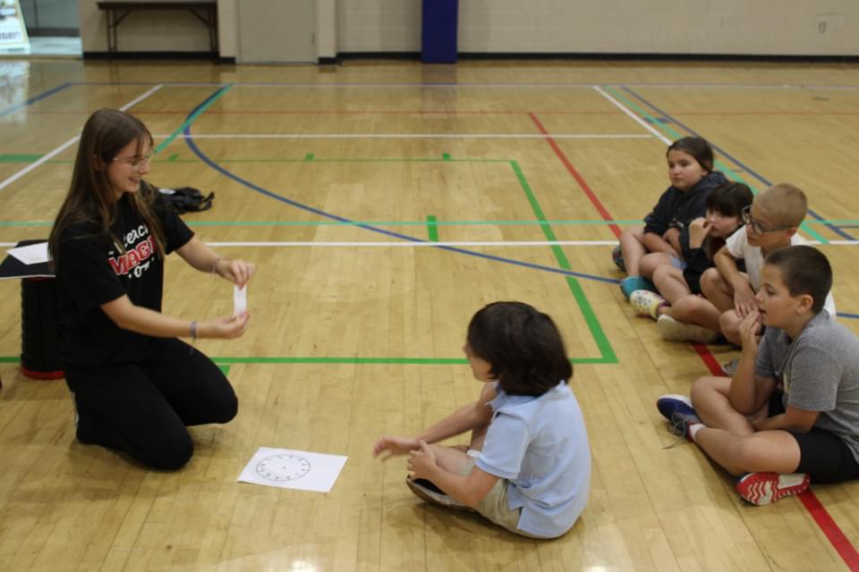 An instructor teaching a group of students