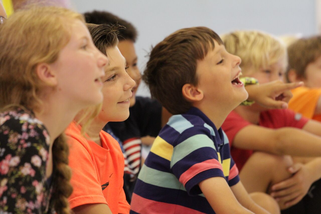 Happy children enjoying a magic class