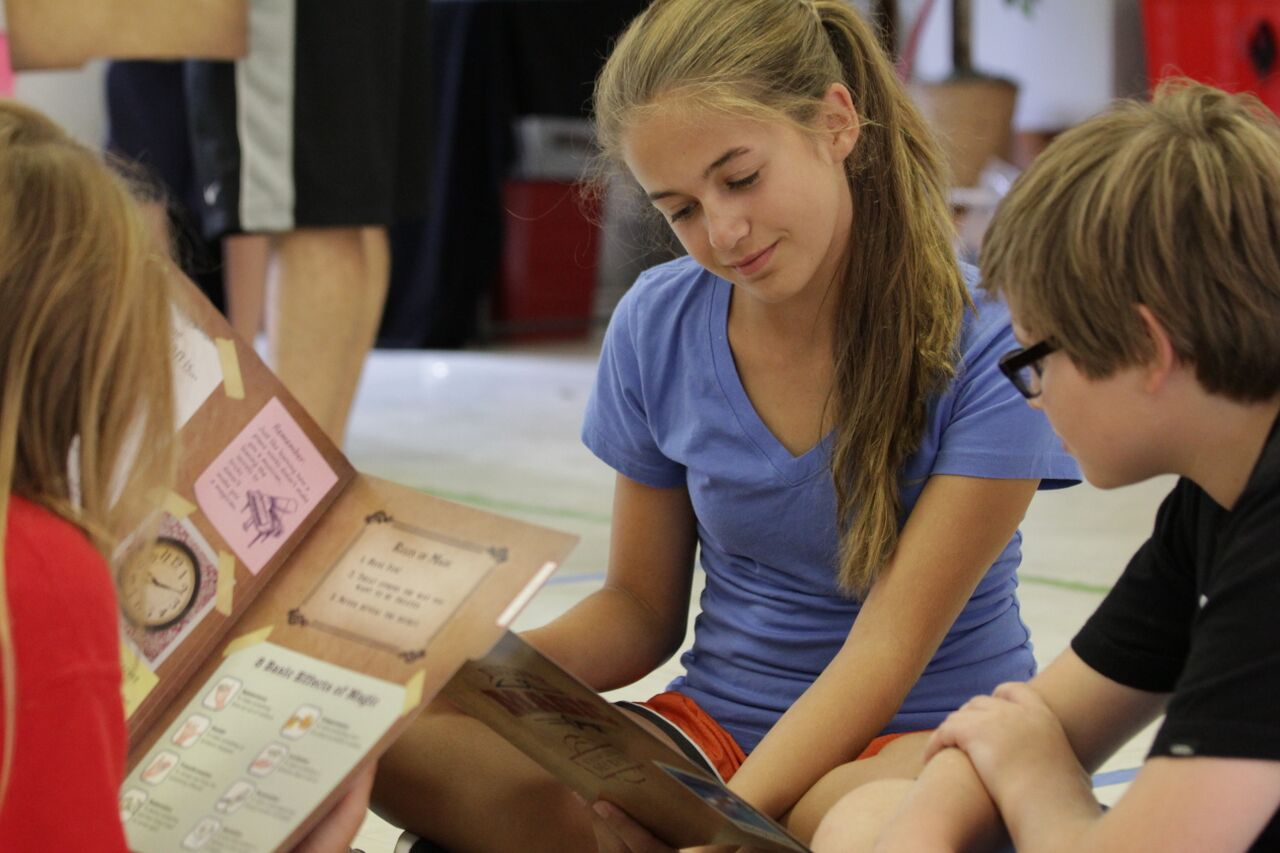 A child performing in a magic class